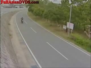 Hapones dalagita rides laruan motorcylcle